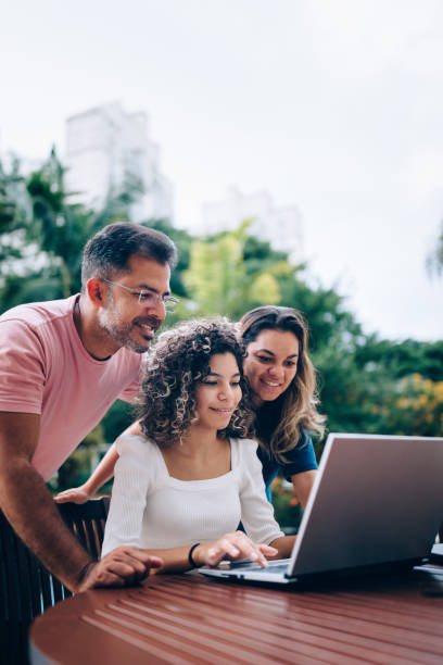 family using laptop at resting area